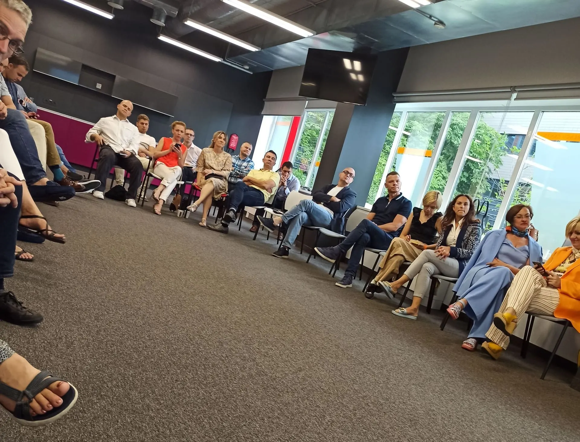 A professional business meeting in a modern office setting