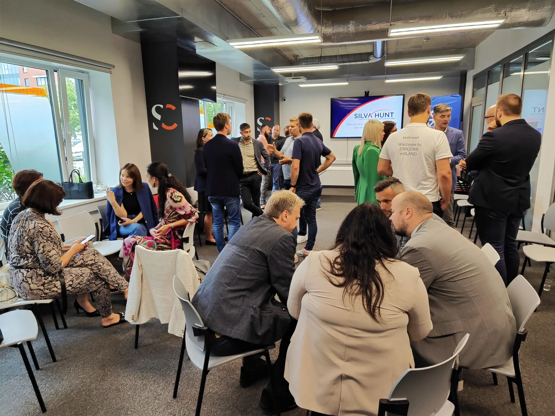 Business professionals networking and collaborating in a modern office environment